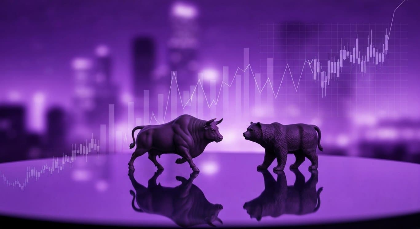 Bull and bear figurines on a reflective surface with a purple cityscape and abstract digital graphs in the background
