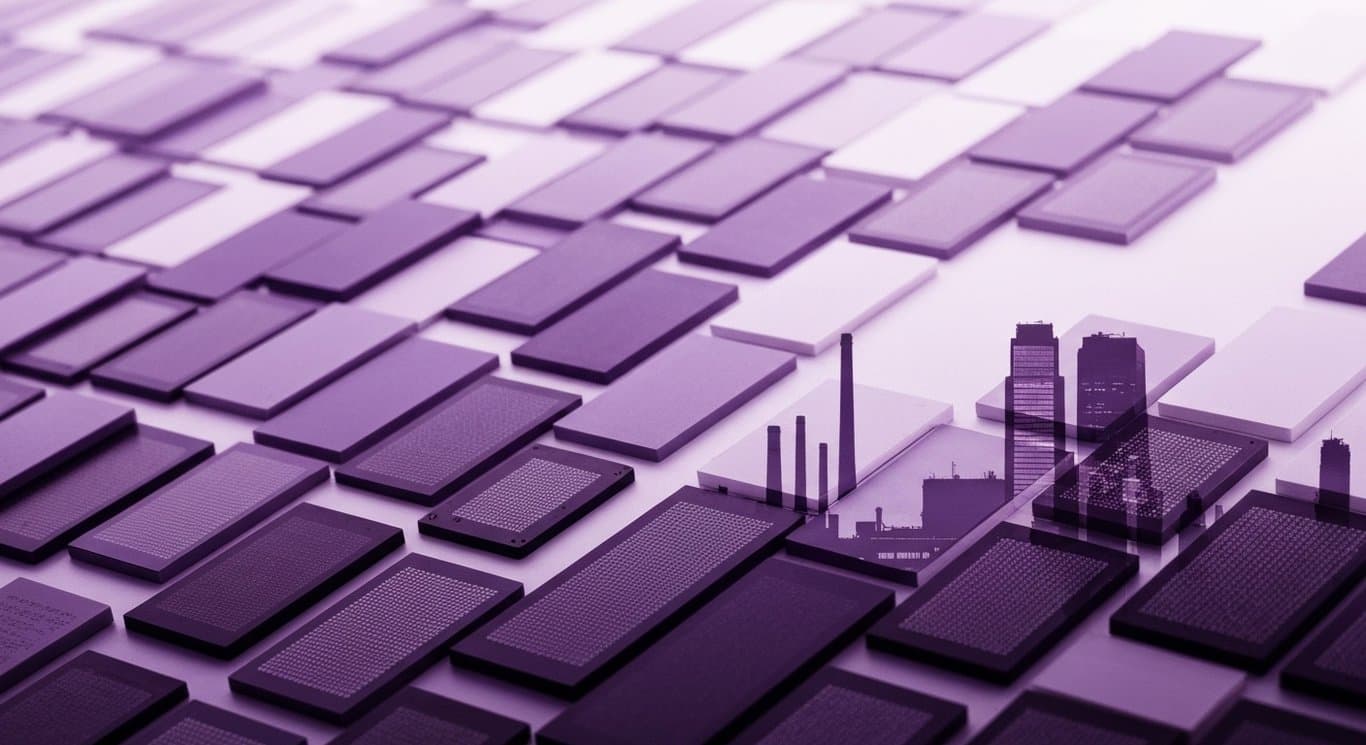 Semiconductor chips arranged upward with faded factories and skyscrapers in the background